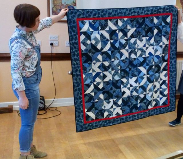 Strip quilt in blues by Mary Palmer