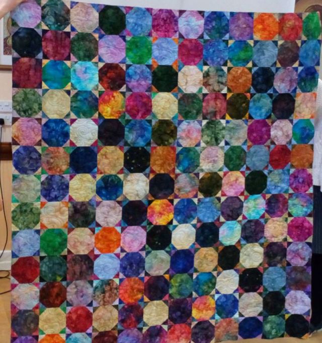 Mary Plamer's batik snowball quilt. It will be bound soon...